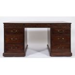An early 19th Century partner's mahogany kneehole desk:,