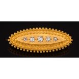 A late Victorian 15ct gold and diamond five stone cannetille brooch: star-set with graduated,