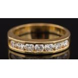 An 18ct yellow gold and diamond seven stone half eternity ring: with circular brilliant-cut