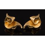 A pair of ribbon design ear clips: stamped '18K', 8.8gms gross weight.