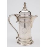 A George VI silver hot water jug, maker Walker & Hall, Sheffield, 1939: with sunburst crest,