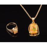 A yellow metal and irregular jelly opal,