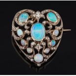 An opal and diamond mounted heart-shaped pendant brooch: of openwork design,