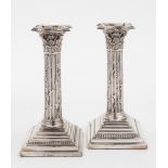 A pair of Victorian silver Corinthian column candlesticks, maker Henry Harrison, Sheffield,