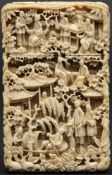 A Canton ivory card case: finely carved overall with figures, pagodas, dragons, flowers and foliage,