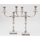A pair of Elizabeth II silver twin branch candelabra, maker JCL,