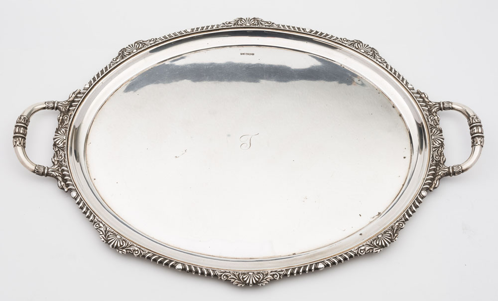 A George V silver tea tray, maker Walker & Hall, Sheffield, 1929: initialled, of oval outline,