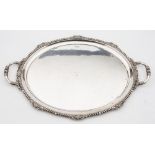 A George V silver tea tray, maker Walker & Hall, Sheffield, 1929: initialled, of oval outline,