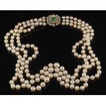 A graduated cultured pearl three-string necklace: the strings composed of 57,