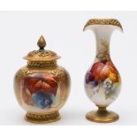 A Royal Worcester porcelain vase and a jar and cover: the former of slender footed form with