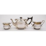 An Edward VII silver three-piece bachelor's tea set, maker Goldsmiths & Silversmiths Co Ltd, London,
