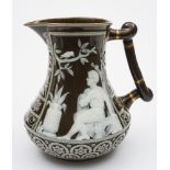 A pate sur pate decorated jug, probably George Jones: in the manner of Schenck,
