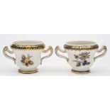 A pair of Tournai miniature two-handled vases: of ogee form with scroll handles,