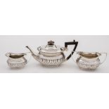 A Victorian matched three-piece silver bachelor's tea service,