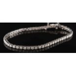 A diamond mounted line bracelet: with 54 round brilliant-cut diamonds estimated to weigh a total of