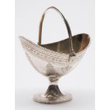 A Victorian silver swing handled sugar basket, maker Walter & John Barnard, London, 1879: crested,