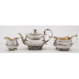 A George III silver matched three-piece tea service.