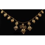 Eleven antique gold and emerald mounted drops mounted as a necklace: the graduated drops with