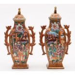 A pair of Chinese 'Mandarin' pattern vases and covers: of flattened baluster form with dragon