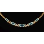 An 18ct gold, aquamarine and diamond necklace: with five graduated,