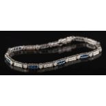 An 18ct white gold, sapphire and diamond line bracelet: mille-grain set with circular,