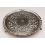 A George III silver salver, maker Charles Hollinshed, London, 1809: crested, of circular outline,