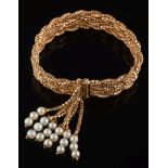 A mesh-link bracelet: the clasp overlayed with a cultured pearl-set tassle, 42.5gms gross weight.