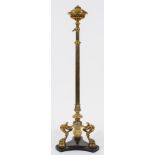 A Victorian brass standard oil lamp:, the reeded adjustable column with circular font,