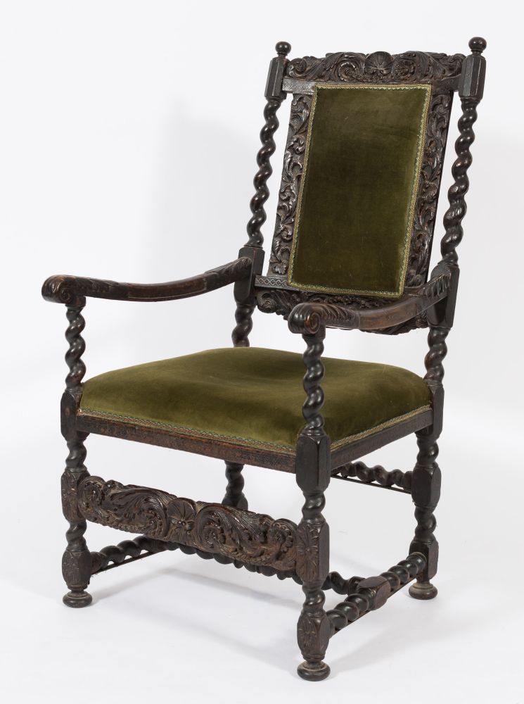 A 17th Century carved walnut and beechwood open armchair:, the upholstered panel back with shell,