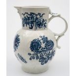 A large First Period Worcester blue and white cabbage leaf jug: with mask head spout,