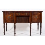 A Regency mahogany and inlaid bow-fronted sideboard:, bordered with ebony lines,