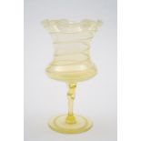 A 'vaseline' glass vase by Harry Powell for Whitefriars: the yellow tinged body of goblet form,