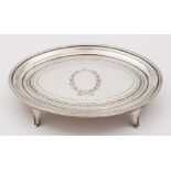 A George III silver tea pot stand, maker Henry Nutting, London, 1800: of oval outline,