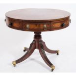 A Regency mahogany, crossbanded and inlaid circular revolving drum top library table:,