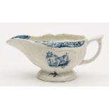 A small Lowestoft blue and white butterboat: of strap fluted silver shape,