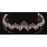 WITHDRAWN LOT A ruby and diamond set bracelet: of textured linking, the clasp stamped '750',