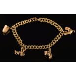 A small 9ct gold charm bracelet: with four various attached charms, 12gms gross weight.