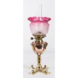 An Arts & Crafts influence brass and copper oil lamp: with Hink's No 2 Duplex wick holder,