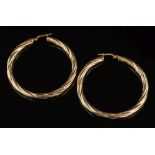 A pair of 18ct gold twist design hoop earrings:, 46mm diameter, 6.5gms gross weight.