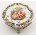 A Meissen porcelain model of a table: of shaped circular form with reticulated frieze,