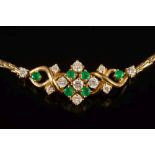 An 18ct gold, emerald and diamond necklace: with cluster of eleven circular,