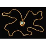 A 15ct gold and opal single-stone heart shaped pendant: on rope twist chain,
