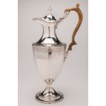 A George III silver wine ewer, maker's mark worn H? , London, 1787: monogrammed,