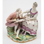 A Vienna porcelain group of a portrait painter and lady: the artist with a palette on his knee and