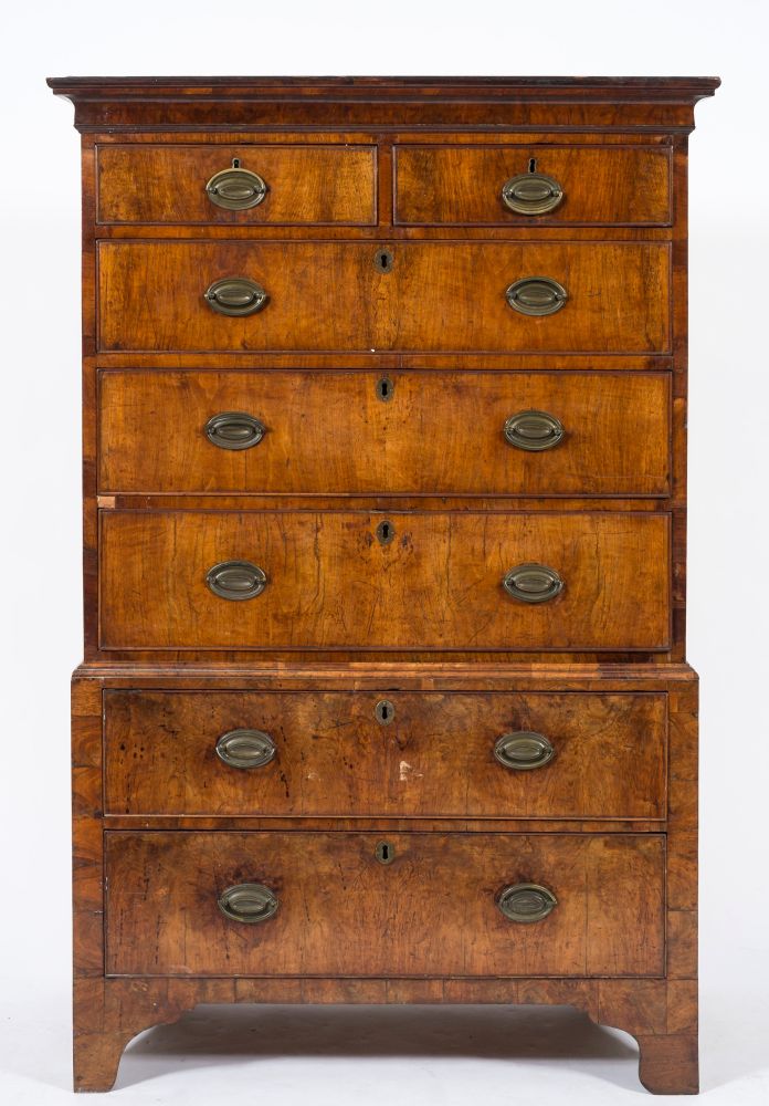 An 18th Century walnut chest on chest:, the upper part with a moulded cornice,