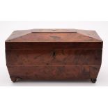 A 19th century yew wood tea caddy: of sarcophagus outline,