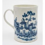 A First Period Worcester blue and white mug: of cylindrical form with grooved loop handle,
