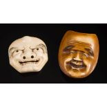 A Japanese carved ivory okimino Noh mask of a smiling man: having a furrowed brow and broad smile,