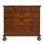 An early 18th Century walnut, inlaid and cross and feather banded rectangular chest:,