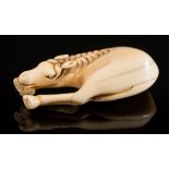A Japanese carved ivory netsuke of a grazing horse: unsigned, Edo period, 6cm.
